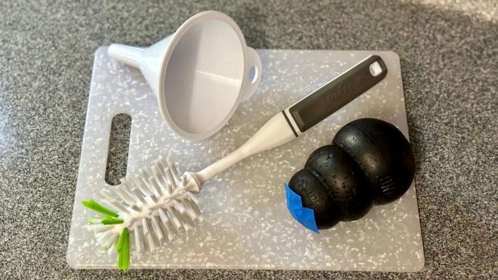 A bottle brush and funnel can make your life much easier with a Kong